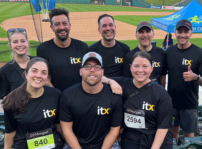 A groupe of ITX Team Members at a baseball court participating of a sport competition