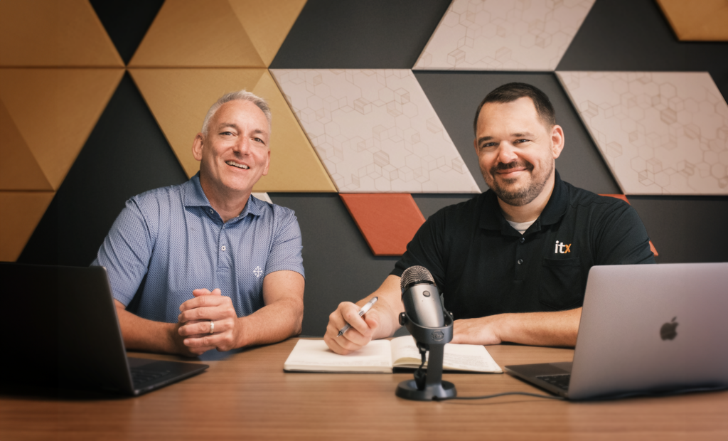 Photo of Sean Flaherty and Paul Gebel in studio Recording a podcast